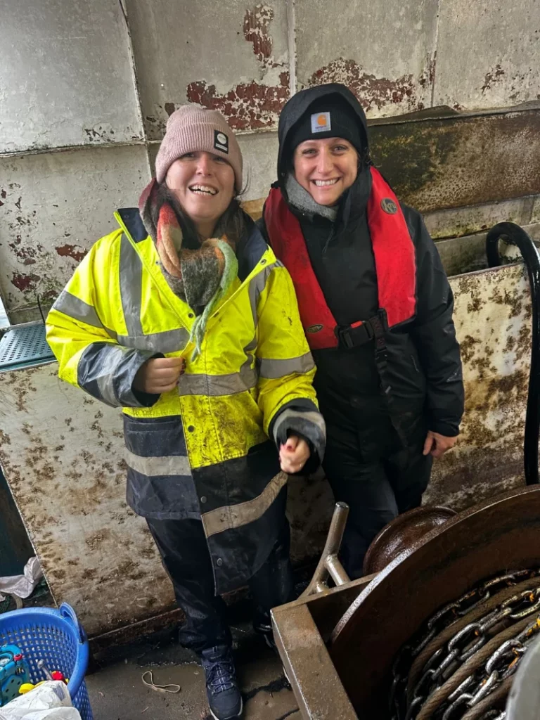 Community Catch team members Abbie Topping and Elodie Le Cornu, aboard the Eilidh Anne and ready for the field trial.